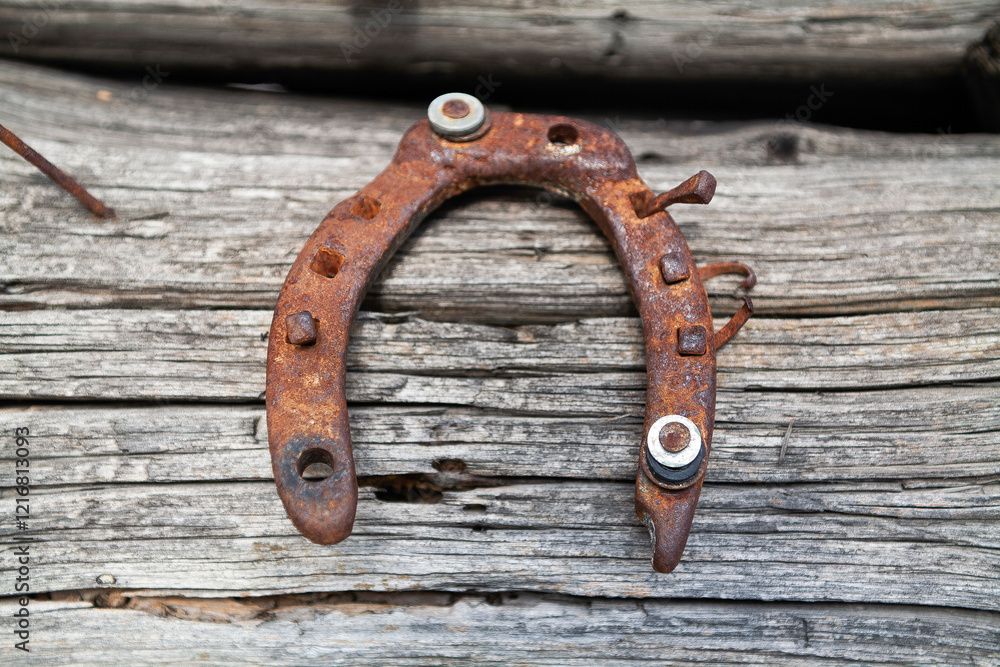 Ancient Rusty Horseshoe Nailed to an Old Timber Beam Ancient Rusty Horseshoe Nailed to an Old Timber Beam