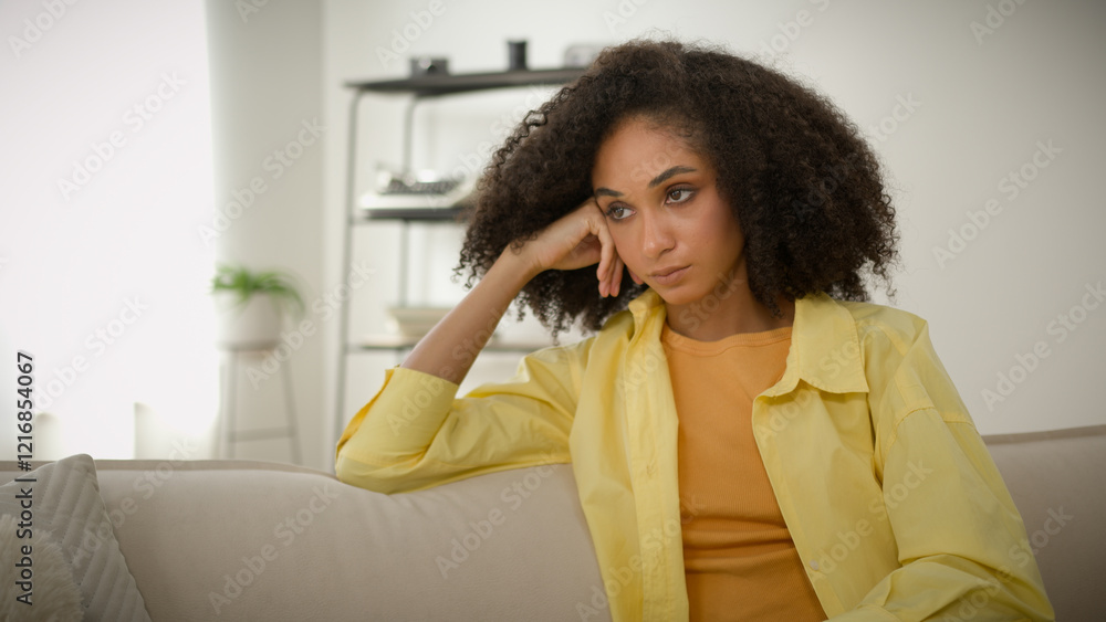 Sad pensive depressed African American ethnic woman upset thoughtful girl female homeowner lonely thinking suffering depression loneliness heartbreak anxiety worry melancholy sadness thought at home Sad pensive depressed African American ethnic woman upset thoughtful girl female homeowner lonely thinking suffering depression loneliness heartbreak anxiety worry melancholy sadness thought at home