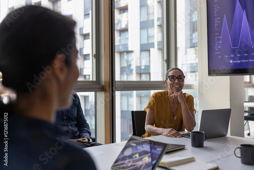 Successful senior businesswoman leading a meeting in the office board room