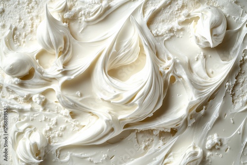 Creamy texture of whipped frosting spread across a surface in a bright kitchen setting