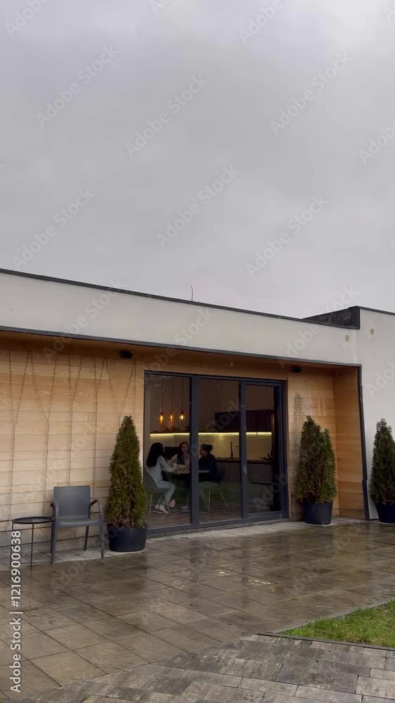 Cozy gathering spot features modern design on a rainy day in the countryside Cozy gathering spot features modern design on a rainy day in the countryside