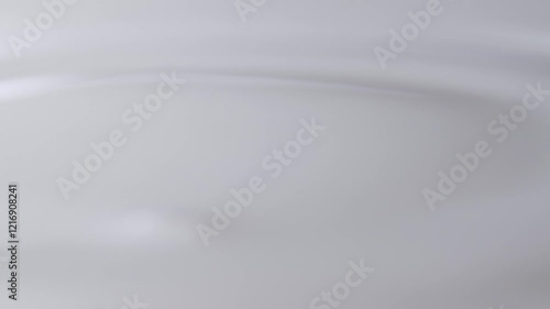 Milk splashing and dripping, white splashes and liquid droplets studio shot