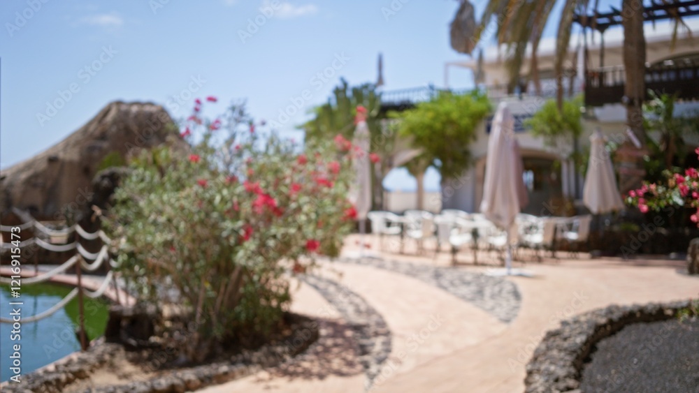 Blurred outdoor scene in lanzarote, spain, showcasing defocused plants, chairs, and umbrellas in a bokeh effect within a canary islands resort setting Blurred outdoor scene in lanzarote, spain, showcasing defocused plants, chairs, and umbrellas in a bokeh effect within a canary islands resort setting