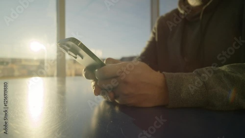 Wallpaper Mural A Young Man Sends And Receives SMS Messages On His Smartphone, Highlighting The Use Of Mobile Tech, Push Notifications, And Instant Communication. The Close-Up Captures The Modern Digital Experience. Torontodigital.ca