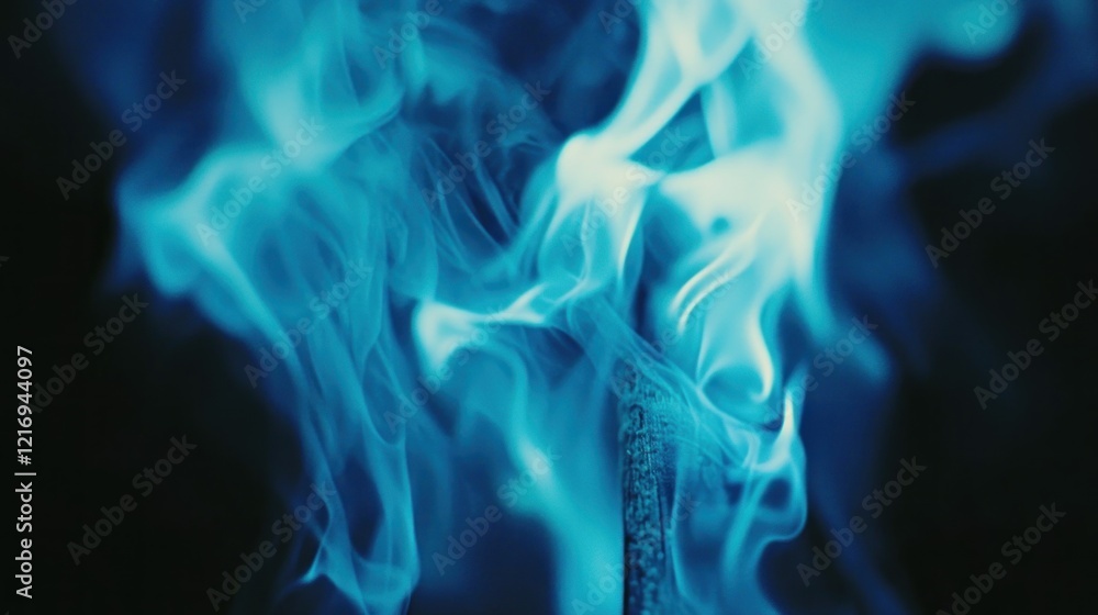A close-up image of blue flames and smoke, creating an ethereal and dynamic visual effect. A close-up image of blue flames and smoke, creating an ethereal and dynamic visual effect.
