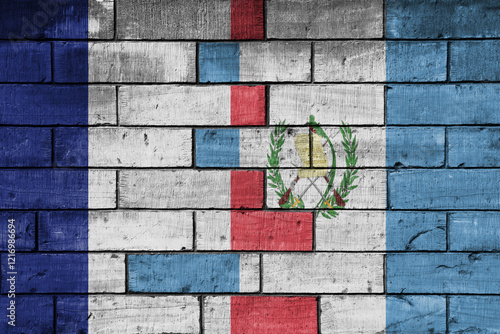 colourful painted big flag of france and flag of guatemala on a massive old brick wall background. concept photo