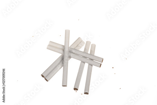 Close up white cigarattes and tobacco grains isolated on white background. Concept of harm of smoking. Free area for text photo