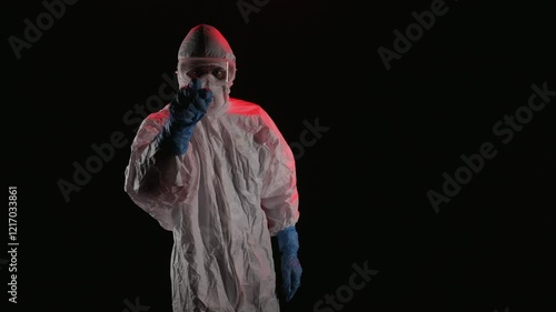 Scientist in PPE pointing at the camera