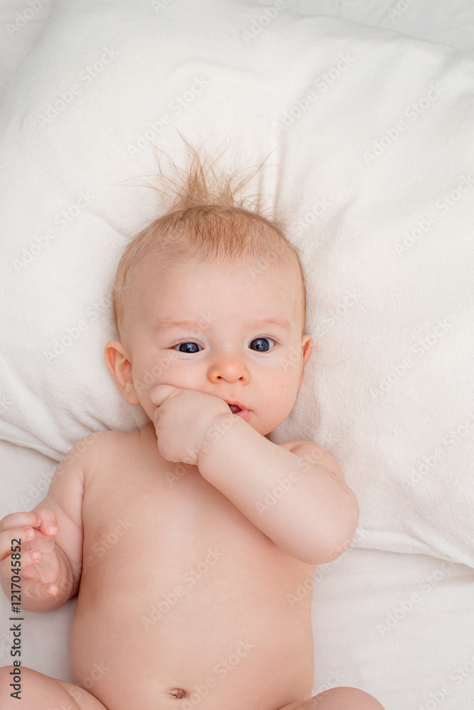 small beautiful child with blue eyes, holding hands in mouth
small beautiful child with blue eyes, holding hands in mouth