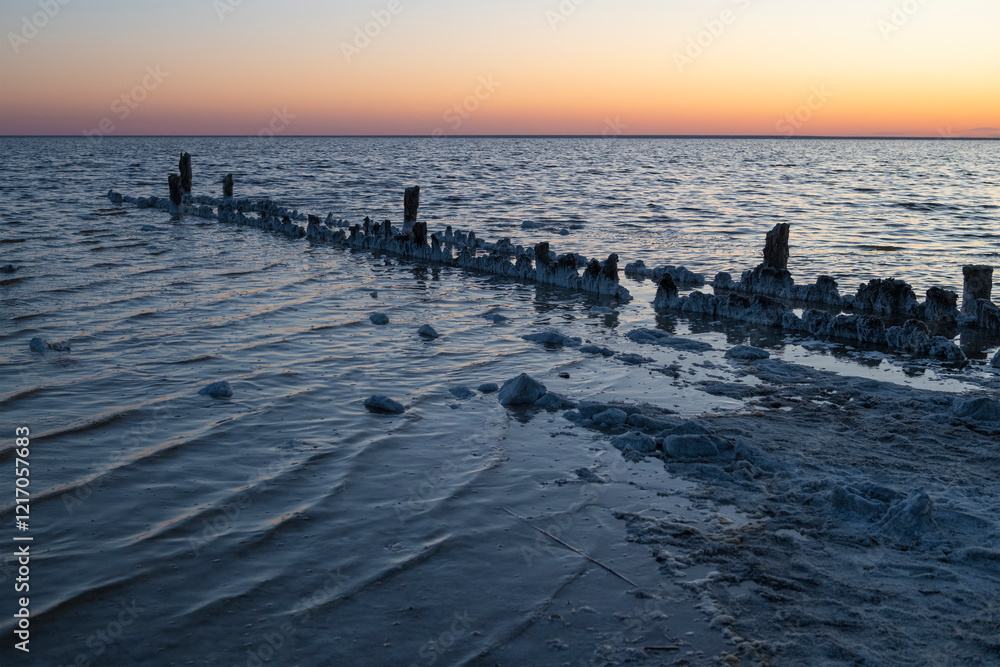Obraz premium Evening at the old pier. Salt lake of Elton. Volgograd region, Russia
