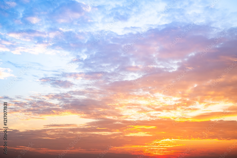 Fototapeta premium Beautiful , luxury soft gradient orange gold clouds and sunlight on the blue sky perfect for the background, take in evening,Twilight, Large size, high definition landscape photo