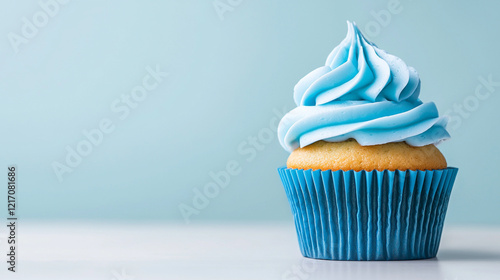 Delicious cupcake with blue frosting on a light background, perfect for sweet treats.
