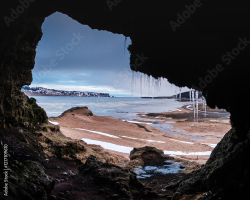 View from Loftsalahellir cave with Reynisdrangar sea stacks in the background, South Iceland photo