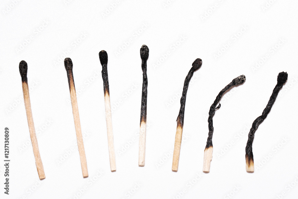 Burnt Matches in Sequence on White Background Burnt Matches in Sequence on White Background