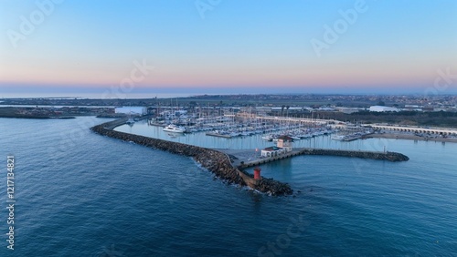 Il Porto turistico di Ostia al tramonto. Roma, Italia.
Viasta aerea al tramonto del porto di Ostia lido con le barche ormeggiate in banchina. photo