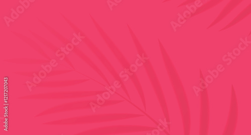 The shadow of palm branches on a bright pink background creates the atmosphere of a tropical summer.
