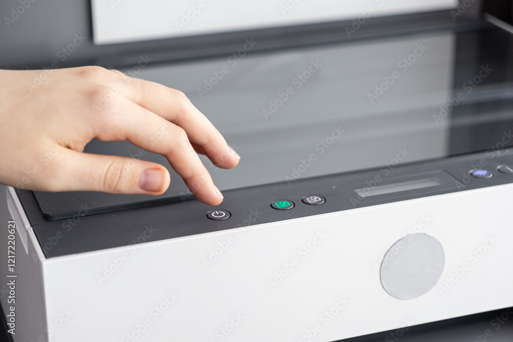 Turning On a Modern Wireless Printer by Pressing the Power Button on the Control Panel Turning On a Modern Wireless Printer by Pressing the Power Button on the Control Panel