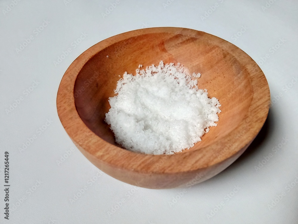 salt in a wooden container. salt in a wooden container.