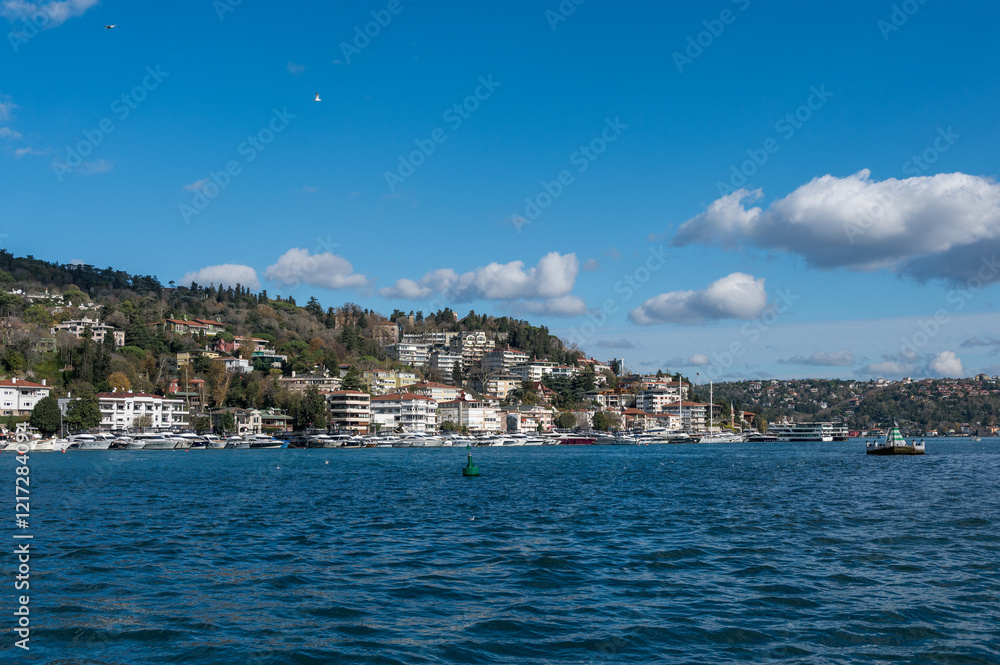 Beautiful view of the Bosphorus shore on a sunny day, full of residential houses, Istanbul, Turkey. Beautiful view of the Bosphorus shore on a sunny day, full of residential houses, Istanbul, Turkey.