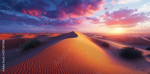 In a surreal scene, pastel skies frame soft pink sandy dunes