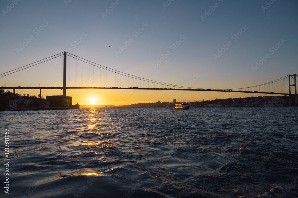Beautiful view of the Bosphorus and the Bosphorus Bridge in the background at sunset.