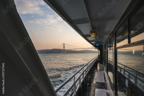 Amazing view of the Bosphorus from the deck of a ferry at sunset, Istanbul, Turkey. photo