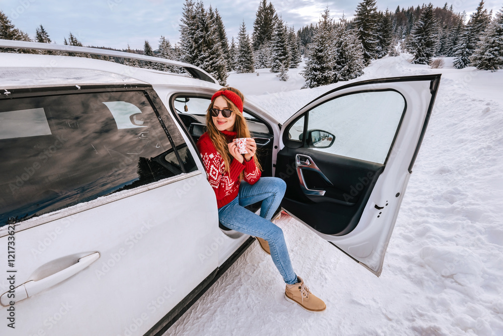 Woman Drinking Coffee during Winter Road Trip