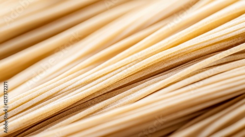 A closeup of freshly boiled soba noodles, their texture glistening under warm light, paired with traditional toppings photo