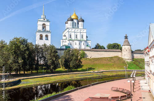 View of the medieval Pskov Kremlin (Krom) and the embankment of the Pskova river in summer day. Pskov, Russia photo