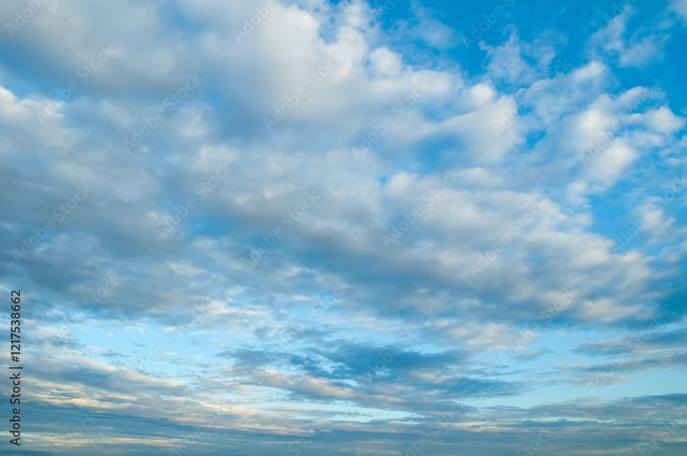 Obraz premium Dramatic evening blue cloudy sky background, picturesque sweeping cloudy sky landscape, panoramic sky scene with dramatic clouds
