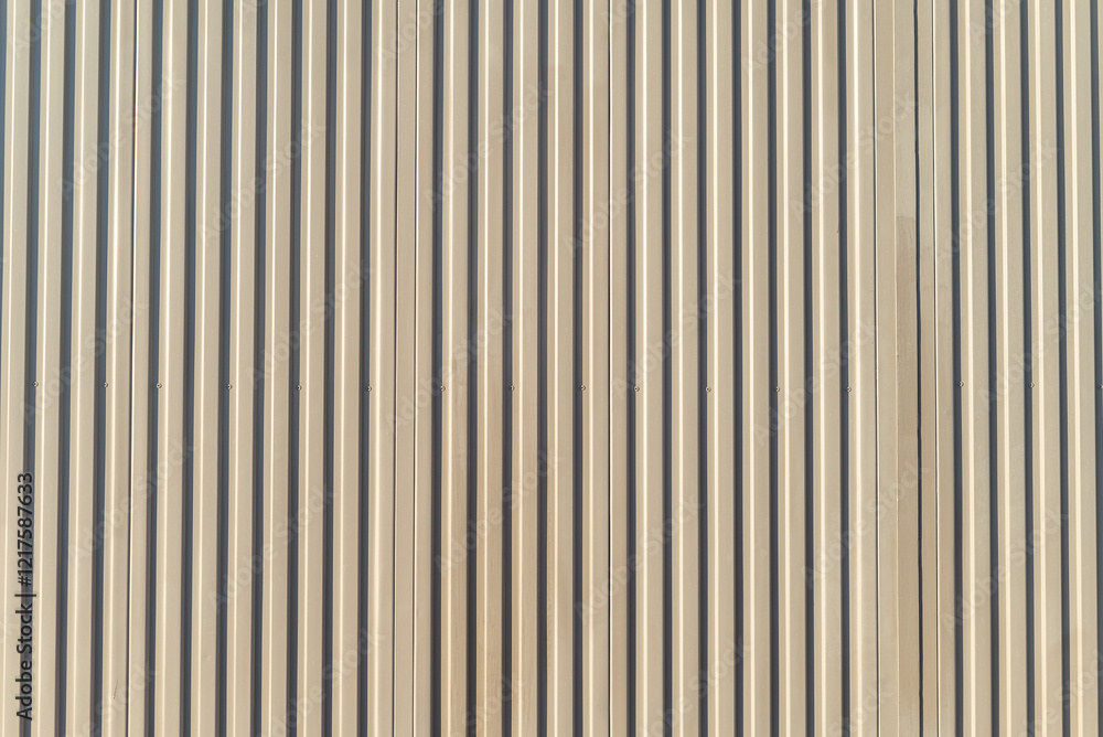 Fototapeta premium corrugated metal door with beige painted vertical lines, rich textured background for design