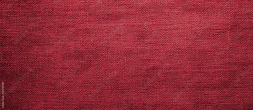 Textured maroon fabric background with a soft woven appearance providing ample copy space for design needs Textured maroon fabric background with a soft woven appearance providing ample copy space for design needs