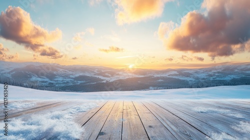 Fototapeta Naklejka Na Ścianę i Meble -  Winter landscape at sunset with clouds and snow-covered hills in background and wooden deck in foreground Copy Space