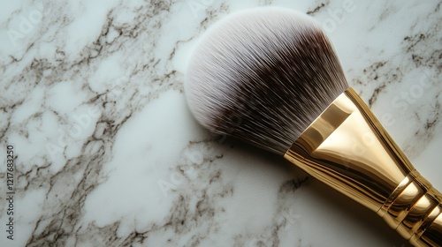 Soft makeup brush resting on a marble surface with beautiful texture and color variations