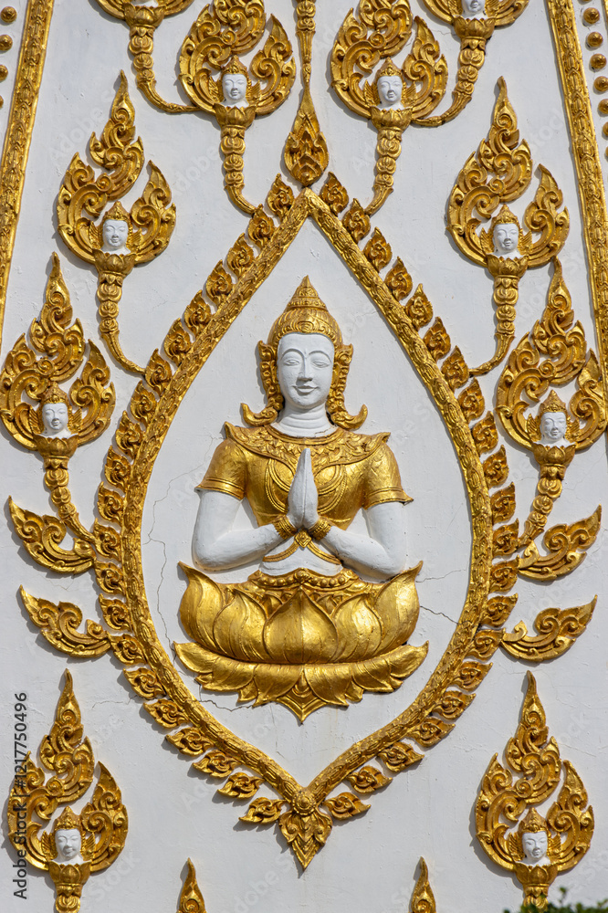 Fototapeta premium A decoration on wall inside the Buddhist temple Wat Phra That Nong Bua, Thailand