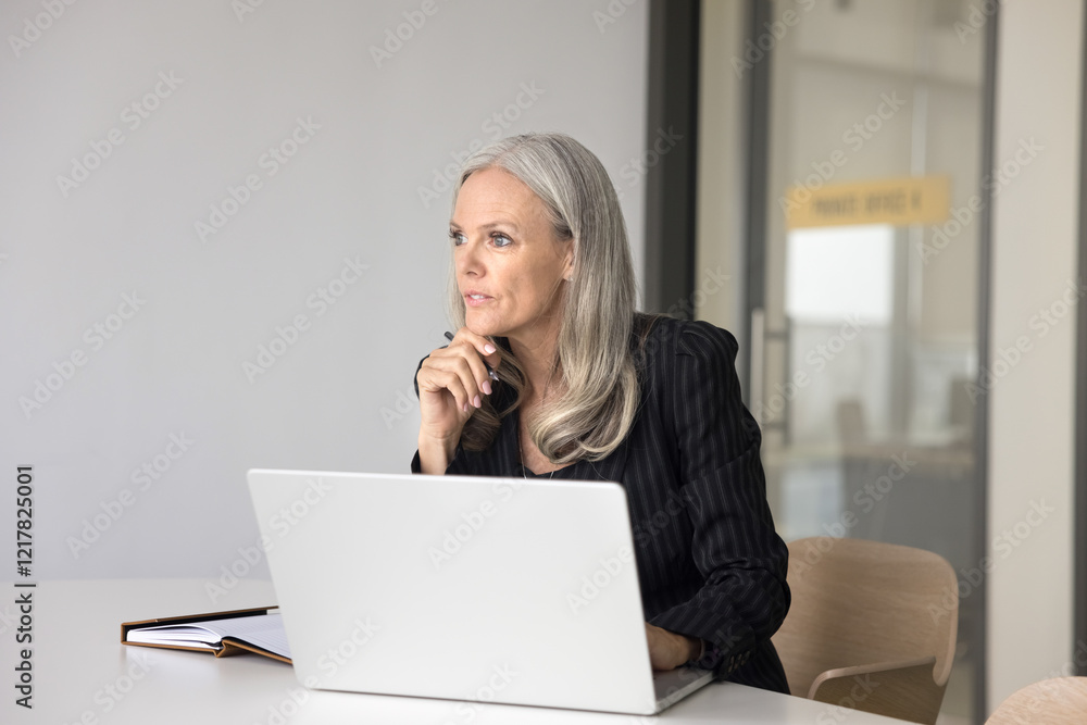 Pensive woman sit at desk with laptop, make work-related decisions, reflects on next steps to achieve professional goals, review training materials for self-improvement, evaluate financial investments Pensive woman sit at desk with laptop, make work-related decisions, reflects on next steps to achieve professional goals, review training materials for self-improvement, evaluate financial investments