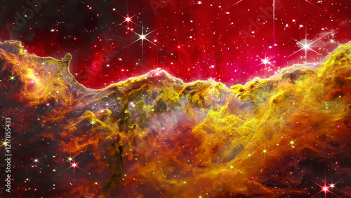 Fototapeta Naklejka Na Ścianę i Meble -  Retouched image. Elements of This Image Furnished by NASA. Artwork. Image depicts a nebula with prominent gold and yellow formations against a deep red background.  Numerous stars.