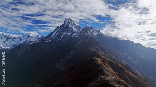 Machapuchare (Fishtail) mountain in the Annapurna Himalayas of Nepal. Aerial drone video from the west of the peak which is often called the Matterhorn of  Nepal.