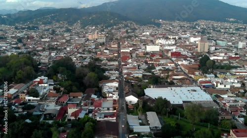 DRONE: DOLLY ZOOM OF URUAPAN MICHOACAN AT SUNSET photo