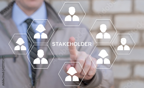 Business person using virtual touch screen push on word: STAKEHOLDER. Stakeholders Business Finance concept. Stakeholder Management.