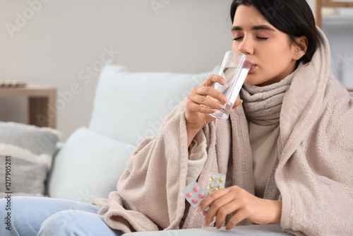 Sick young woman taking med...