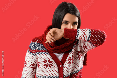 Sick young woman on red bac...