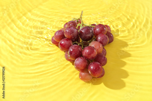 Tasty ripe grapes in water ...