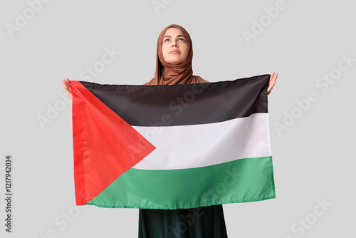 Young Muslim woman with Pal...