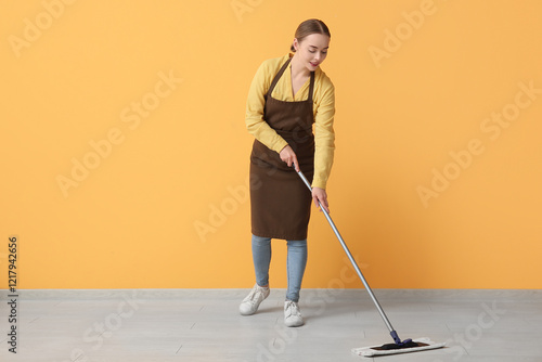 Young woman mopping floor n...