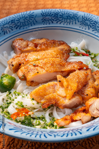 angle view Thai-style chicken with stir-fried Ho Fun or rice noodles at vertical composition photo