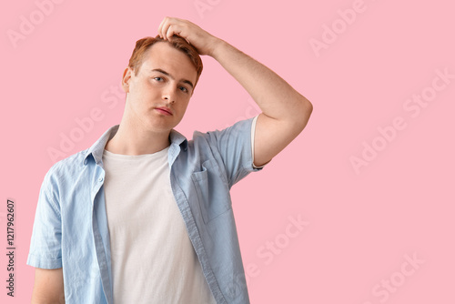 Young redhead man with hair...