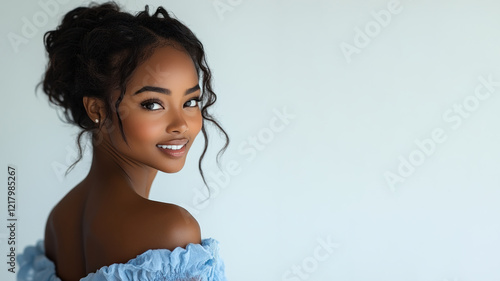 Happy African woman wearing blue dress smiling isolated on white background