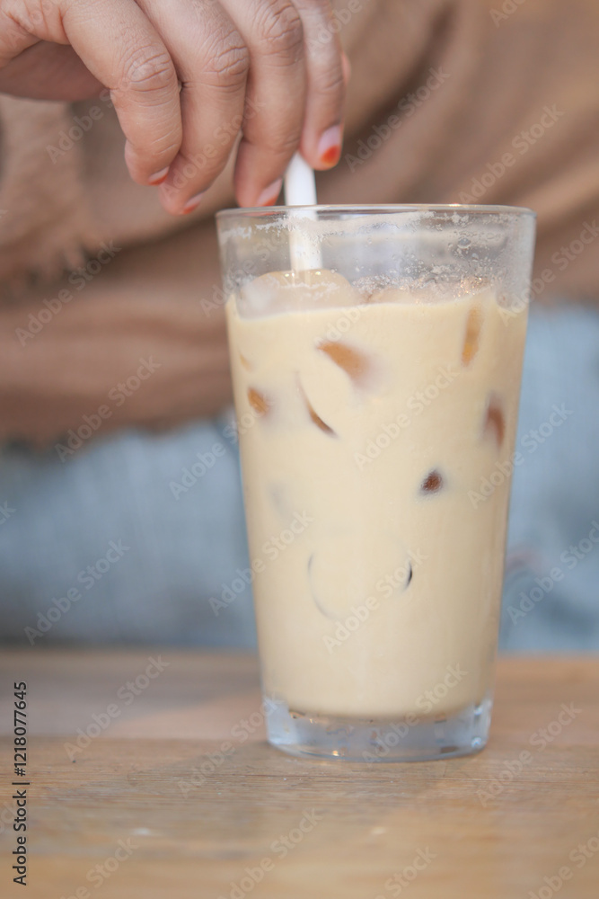 Enjoy a Refreshing Iced Coffee with Creamy Swirls and Ice Cubes for a perfect treat Enjoy a Refreshing Iced Coffee with Creamy Swirls and Ice Cubes for a perfect treat
