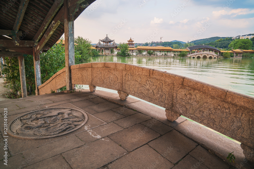 Fototapeta premium An ancient building complex and sunset scenery on the Taihu Lake Lake in Wuxi, Jiangsu Province, China will be on June 3, 2024